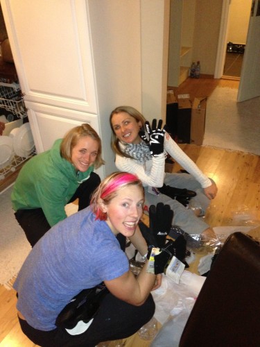 Kikkan, Liz and Holly digging through the glove bag