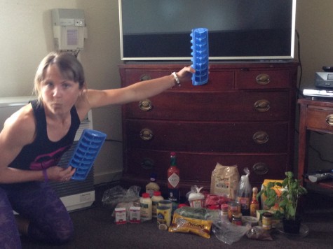 Holly posing with our pile of goodies! Everyone brought up a secret ingredient or spice to "spice up" camp!