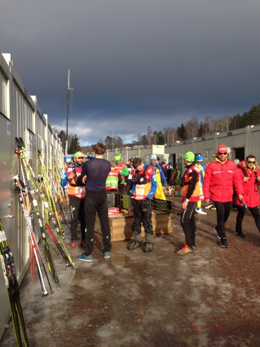 The coaches outside the wax cabins, waiting to see who made it through to the sprint heats