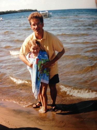 My Dad wrapping me up after I nearly went hypothermic doing a distance challenge swim in Lake Superior. Stubborn from a young age! 