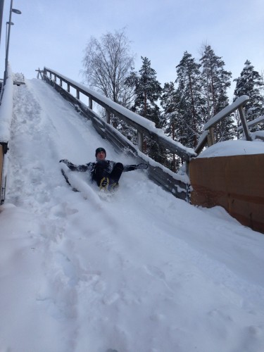 Reese sledding down the old abandoned ski jump we found. 
