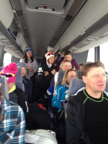The girls bus ride to Quebec city, with everyone watching the men's race during a windy snowstorm! 