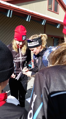 Signing hats and posters and bibs after the races! 