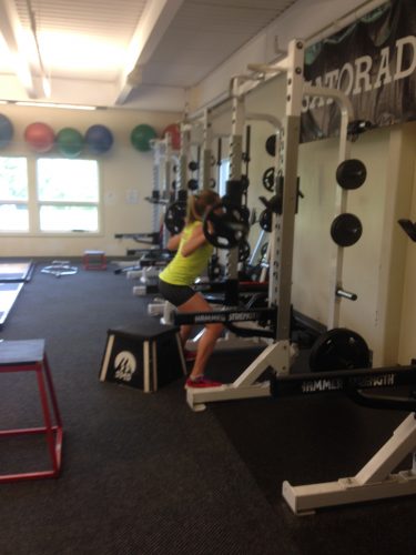 Erika working on her squats in the gym.